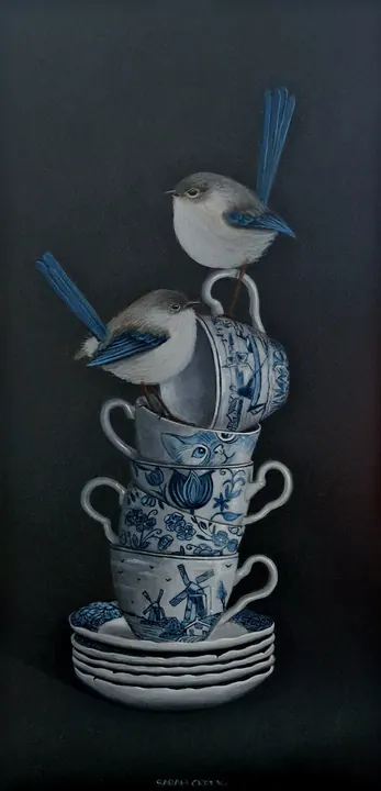 in between, Delft blue cups with little birds.